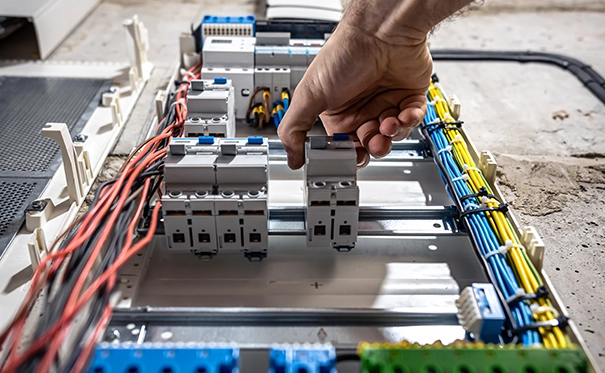 Hand Adjusting Circuit Breaker in Electrical Panel Upgrade Alhambra