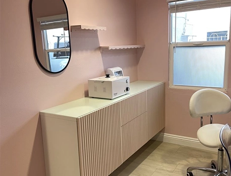 Pink Room with Modern Cabinetry and Wall Mirror